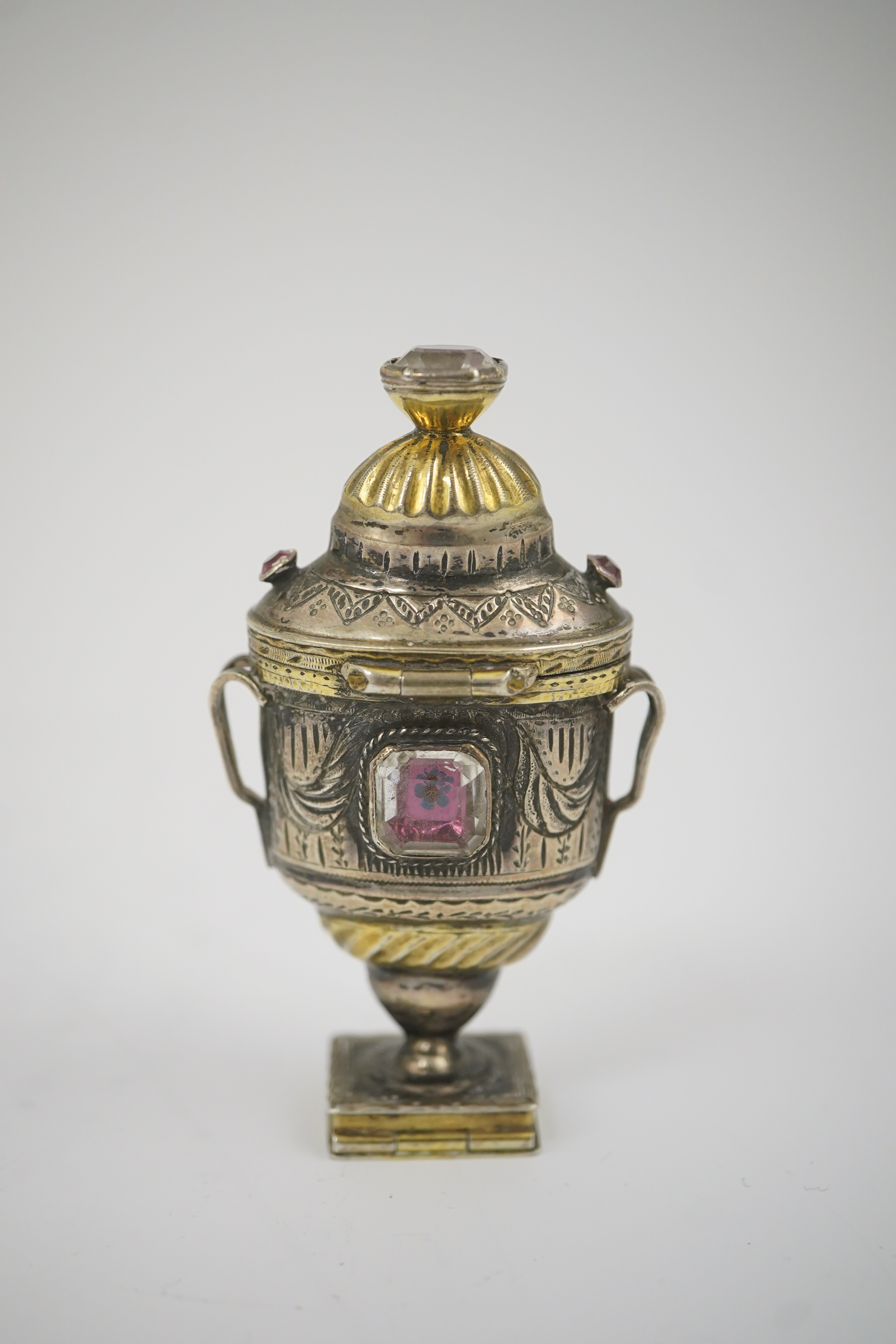 A 19th century continental parcel gilt silver and gem set double ended pill box, modelled as a two handle vase